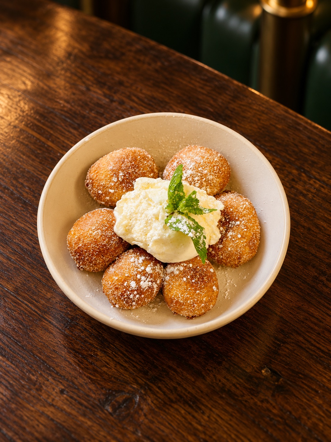 Hazelnut and milk chocolate bombolini with vanilla ice cream