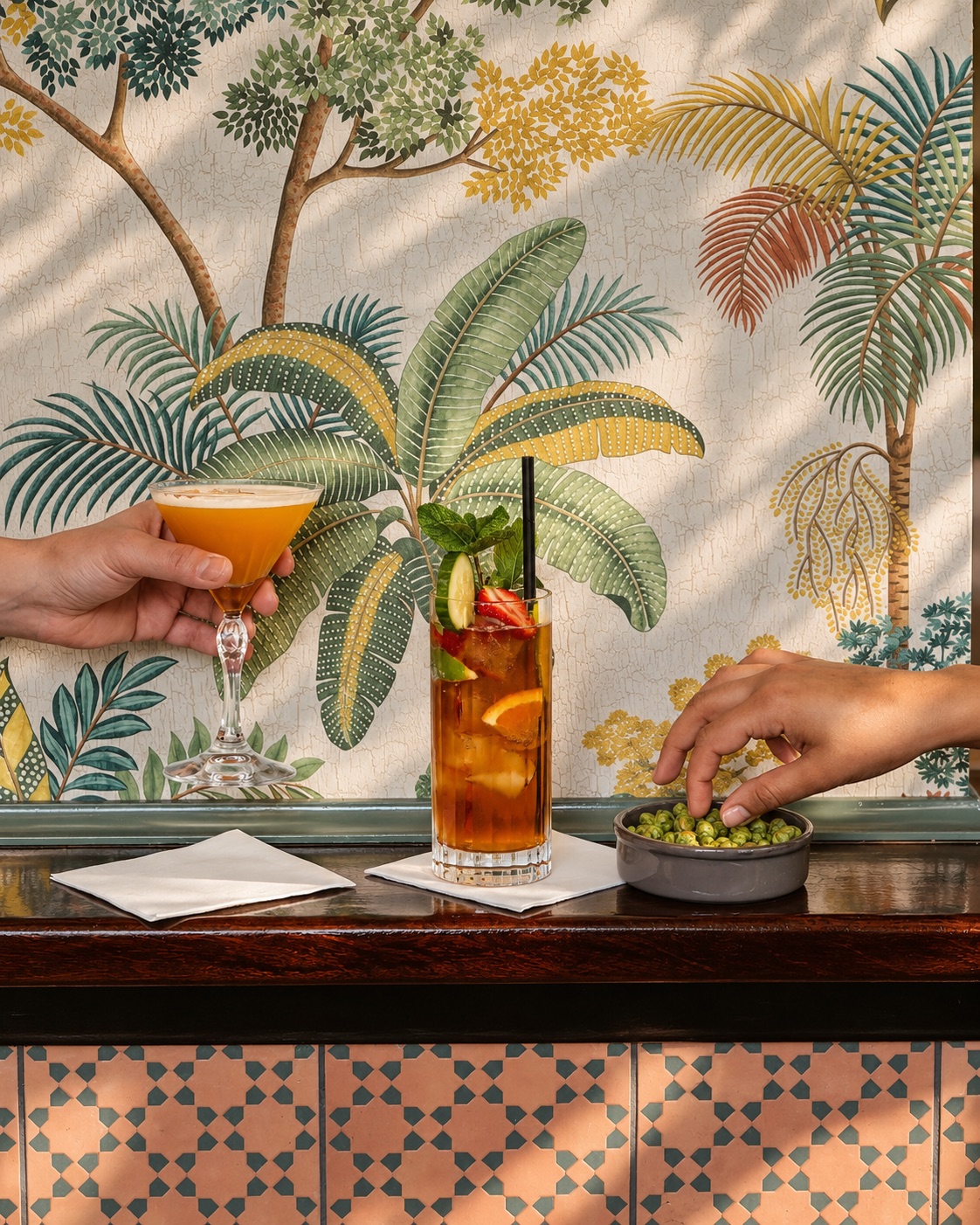 Cocktails against palm-tree wallpaper